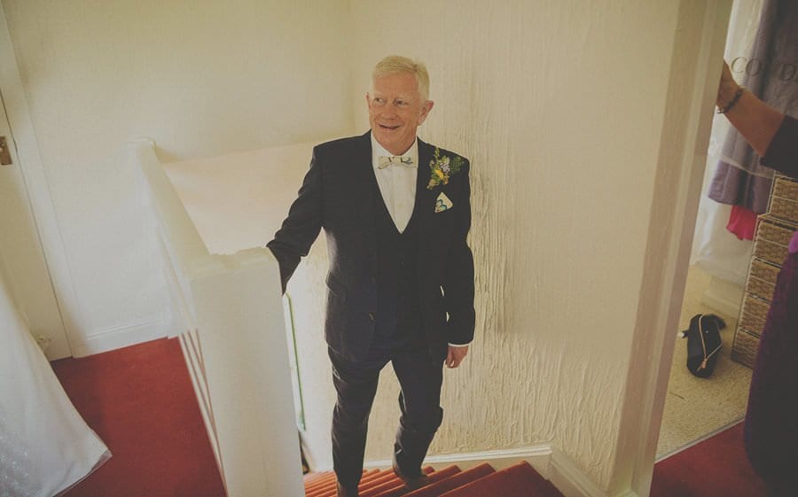 The brides father looks at the bride for the first time