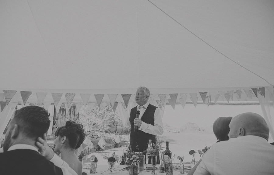 The brides father makes a speech in the marquee at Penmaen house