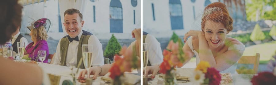 The bride and groom laugh at the father of the brides speech