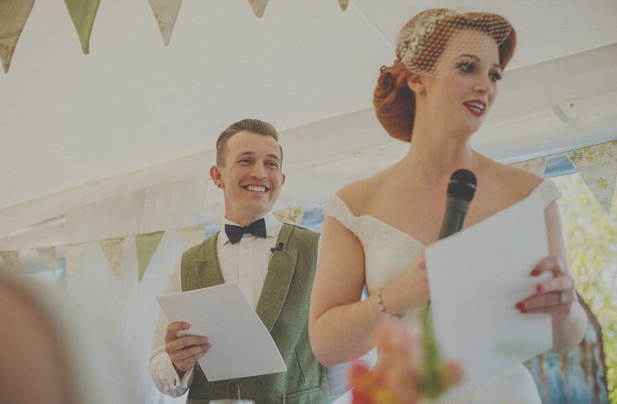 The bride and groom deliver their speech in the marquee at Penmaen house