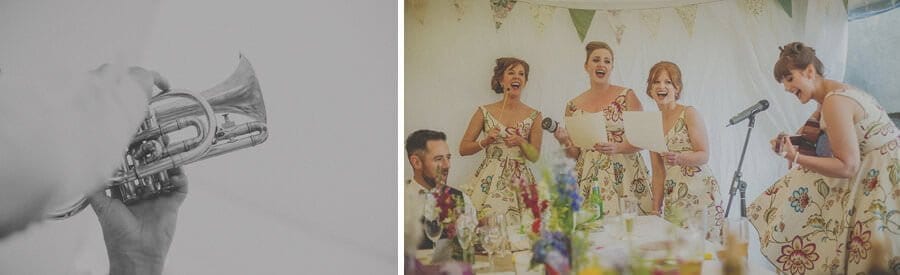The bridesmaids sing a song in the marquee at Penmaen house