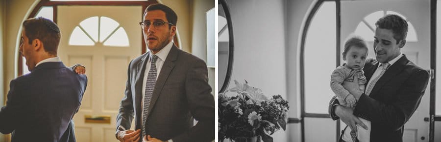 The brides brothers get ready in the hallway of their parents house