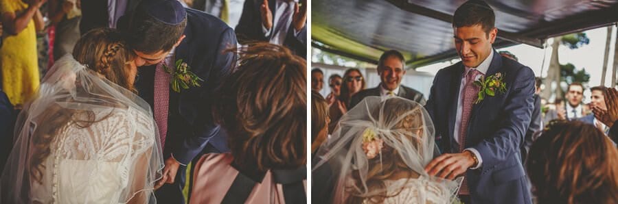 The groom bends down and kisses the bride