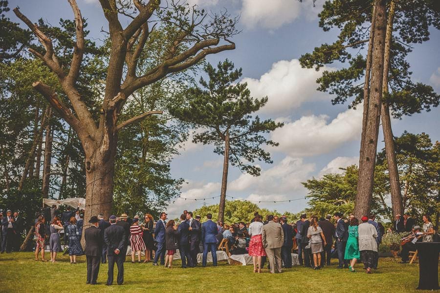 Wedding guests gather together for the outdoor jewish ceremony