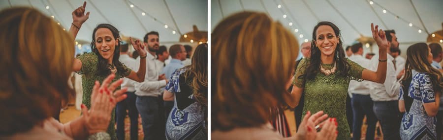The brides sister dances on the dancefloor of the marquee