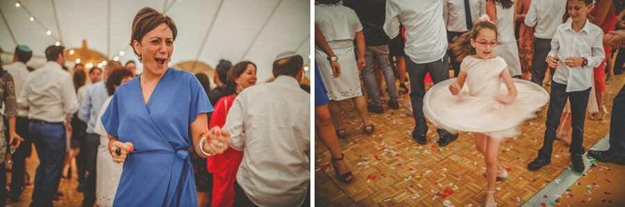 A girl spins around on the dancefloor in the marquee