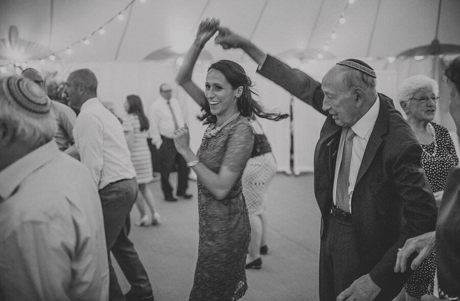 The brides sister dances with her grandfather on the dancefloor