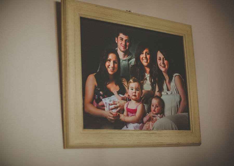 Family portrait on the wall of the house