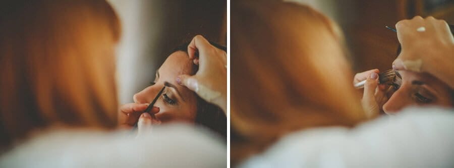 The bride has her eye liner applied