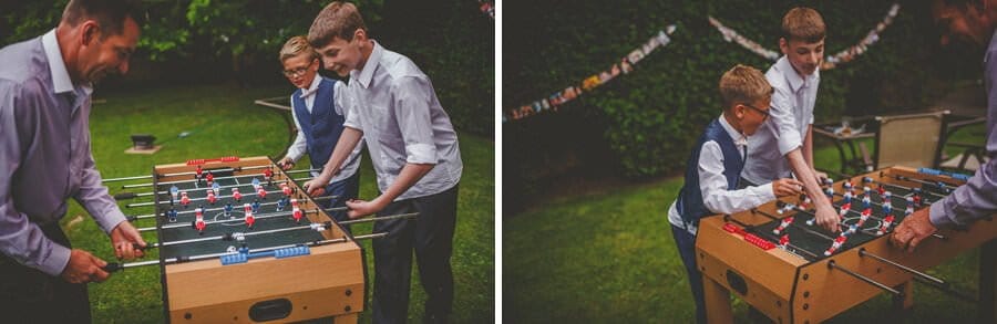 Wedding guests play table football