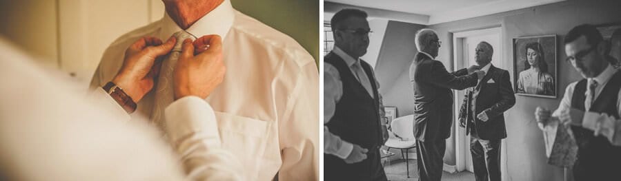 The best man straightens the grooms tie