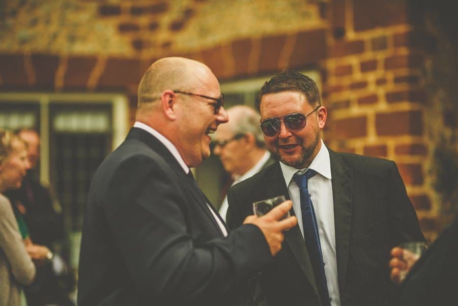 Wedding guests talk with one another