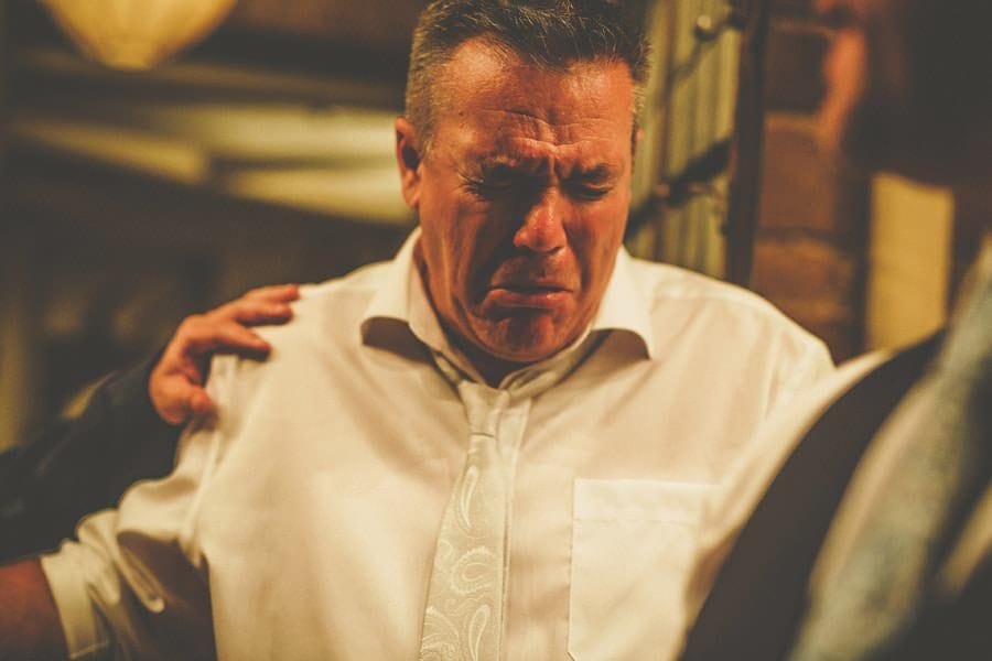 An usher inhales smoke from a cigar