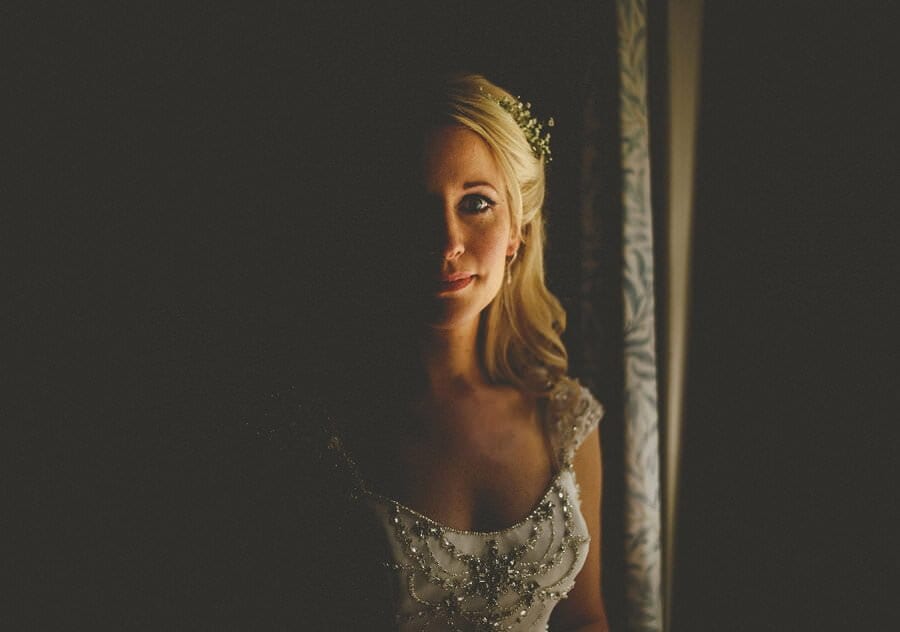 The bride stood next to a window at Cole Hayes park