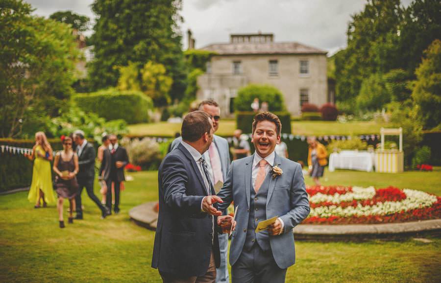 The groom enjoys a joke with friends on the way to the ceremony