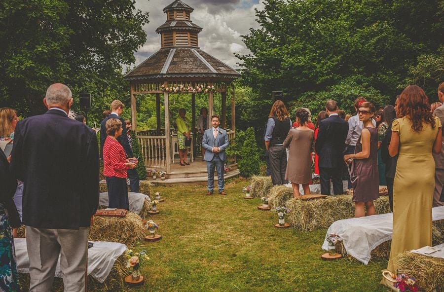 The groom stands and waits for the bride to arrive