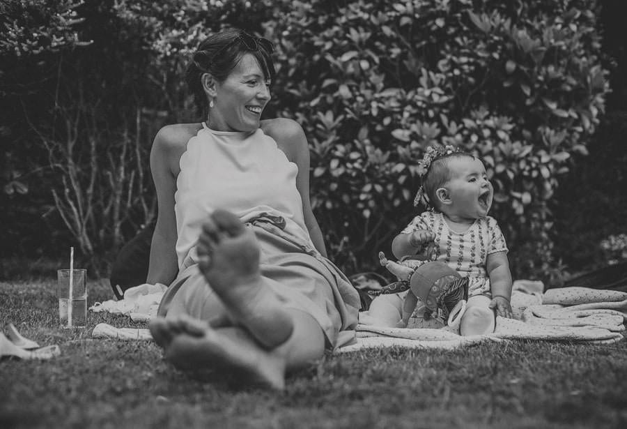 A baby laughs on the back lawn at Cole Hayes park
