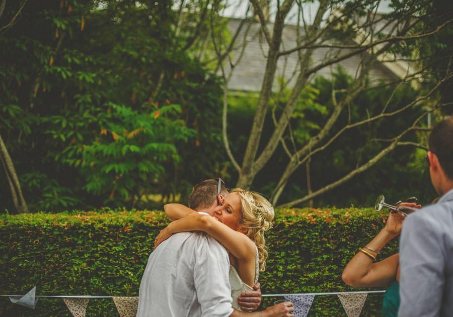 The bride embraces a friend