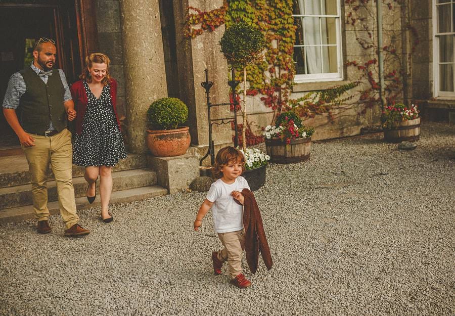 A family walk towards the marquee