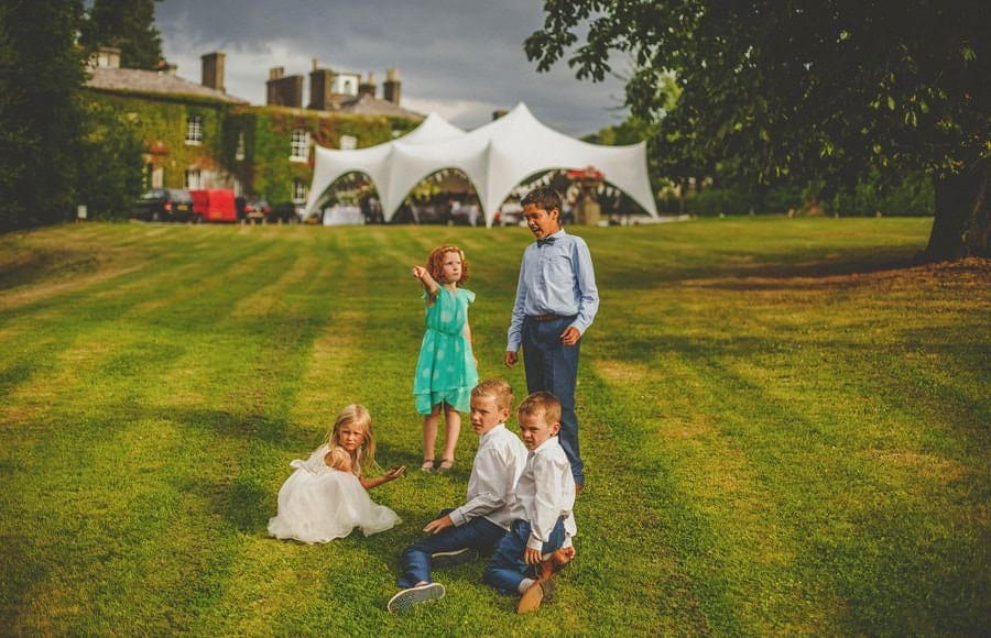 Girls and boys playing on the lawn