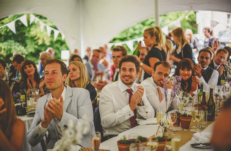 The wedding guests applaud the brides speech