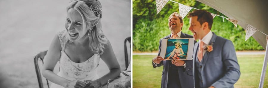 The groom and his best man laugh at photographs of the bride