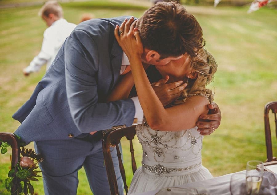 The groom kisses the bride