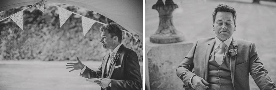 The best man delivers his speech as the groom listens on