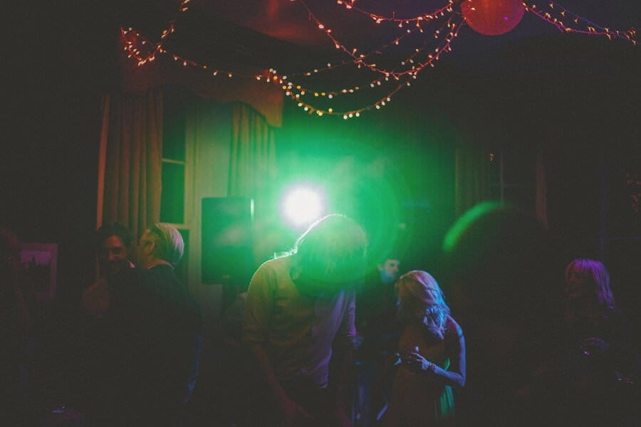 Wedding guests dance in the main hall