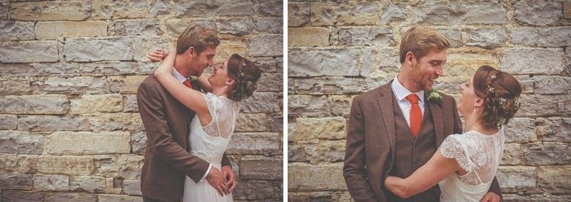 The bride and groom look at each other outside Almonry Barn