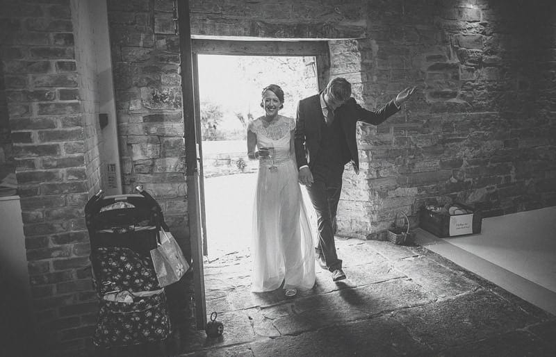 The bride and groom enter the barn