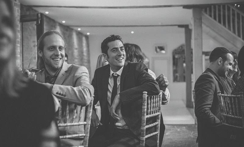 A wedding guest laughs during one of the wedding speeches