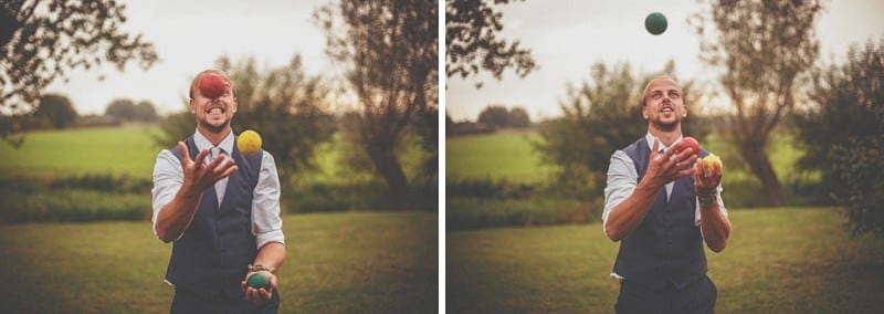 A man juggles balls on the grass outside Almonry Barn