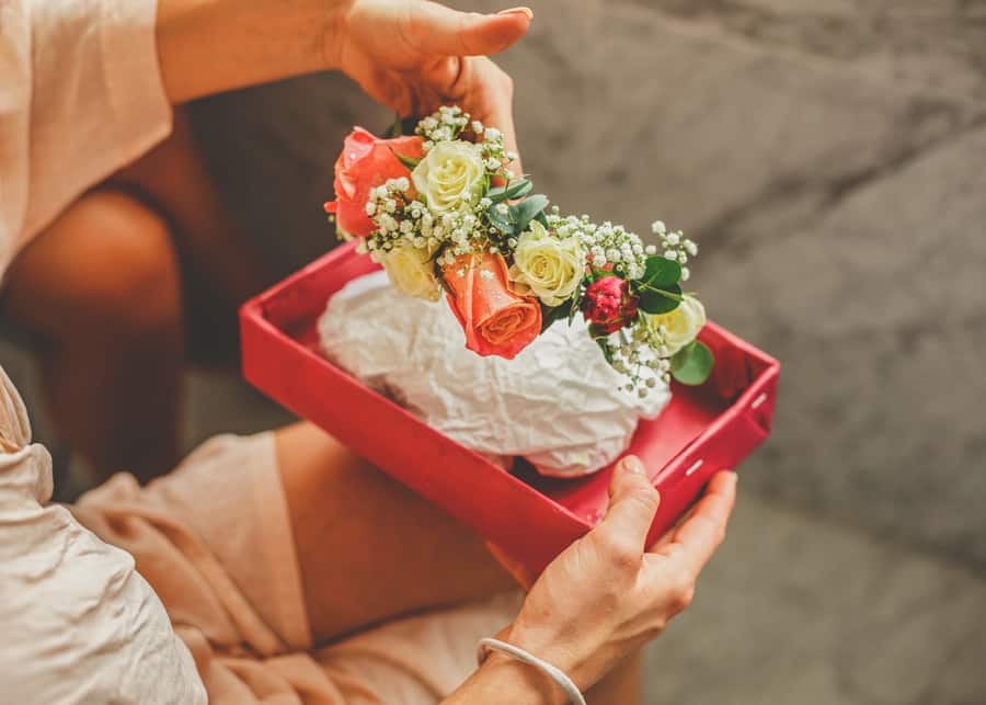 The bride looks at her flowers