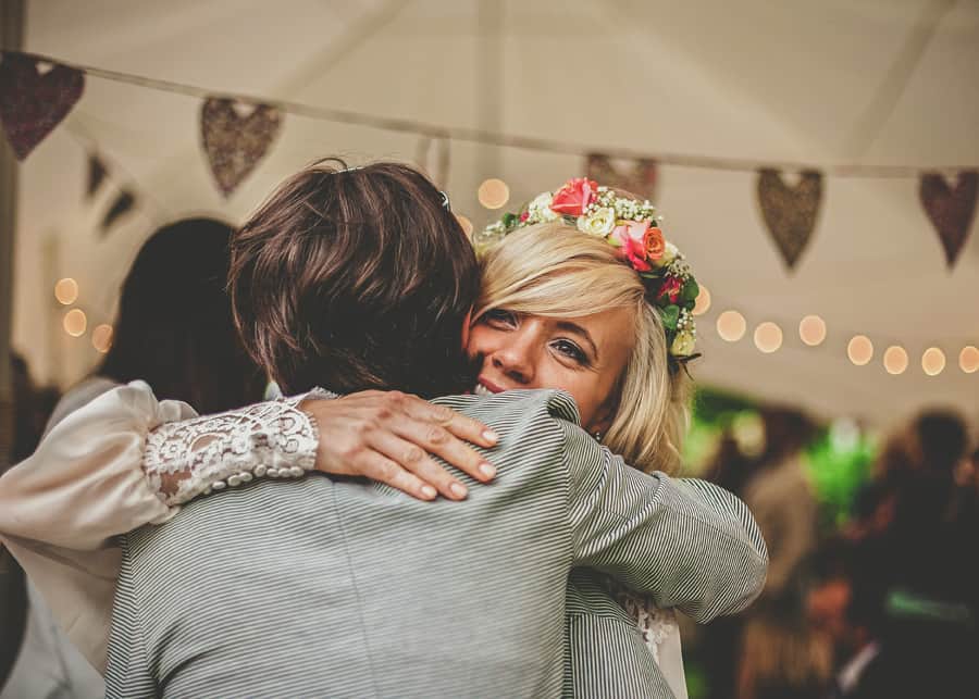 The bride embraces an old friend