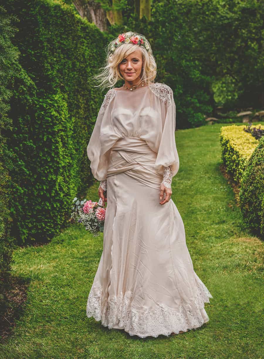 The bride in the back garden at Sharpham Park