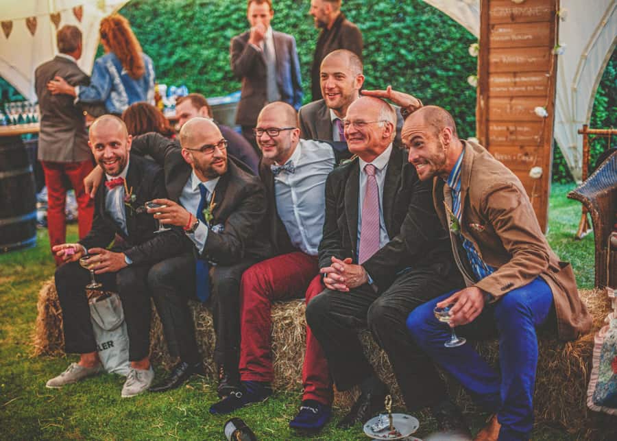 The ushers pose for photographs