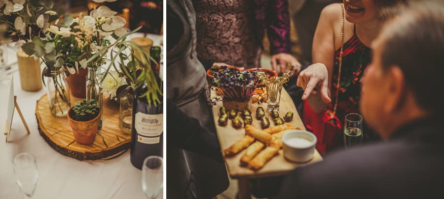 A lady points at a food platter and the wedding table at the Tithe Barn in Symondsbury