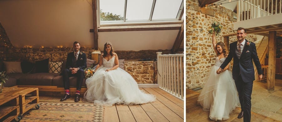 The bride and groom walk into the Tithe Barn in Symondsbury