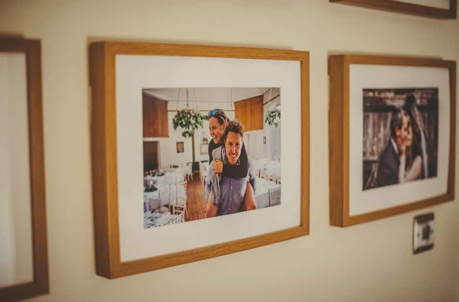 A framed photograph of the bride and groom hangs in the hallway at Mill farm