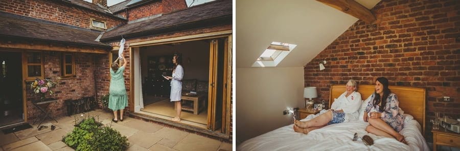 A family friend takes down a flower girls dress that is hanging from the gutter