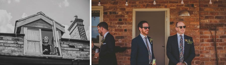 The brides mother looks out of the top window at Mill farm