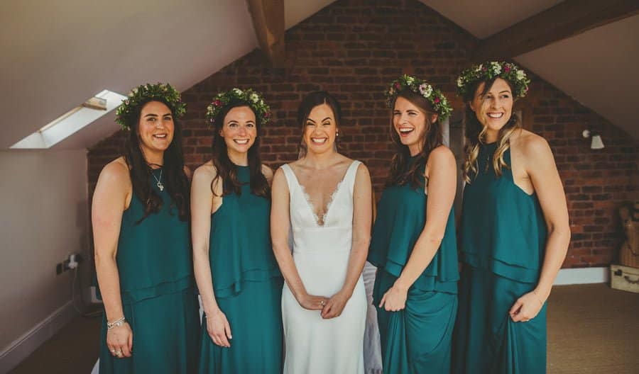 The bride and the bridesmaids pose for a photograph
