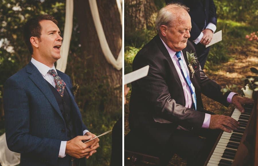 A wedding guest sings and the brides father plays a piano during the outdoor ceremony