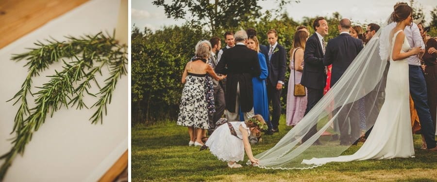 A flowergirl straightens the brides dress