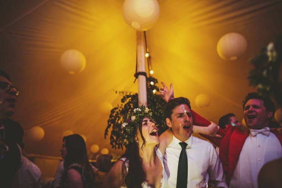 The bride and a friend singing in the marquee