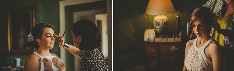 The make up artist rubs a bridesmaids eyebrows and the hairdresser fastens the back of a bridesmaids hair