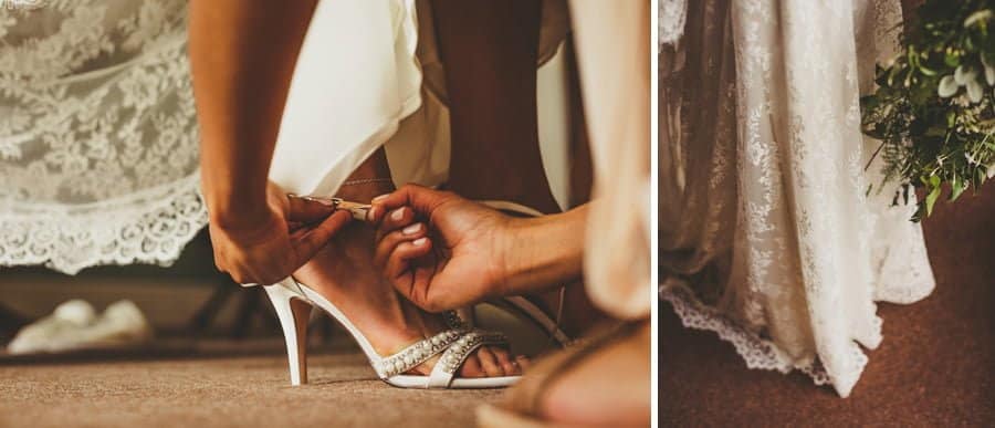 A bridesmaid fastens the buckle of the brides wedding shoes