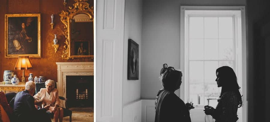 Wedding guests drink champagne and talk amongst themselves at Stubton Hall