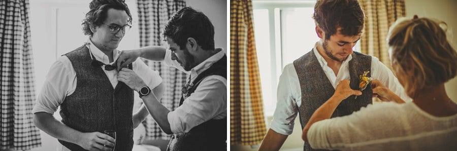 Placing the flowers on the lapels of the best man and groom